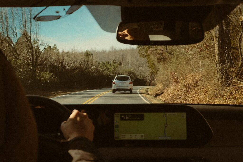 View of the road through a car windshield; illustrative driving photograph