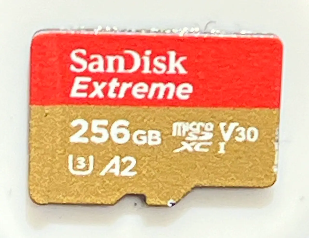 SanDisk Extreme 256GB microSD card showing capacity and speed markings.
